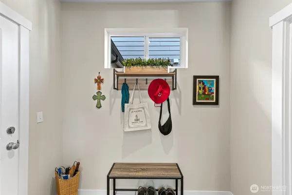 a view of a storage & utility room with a window