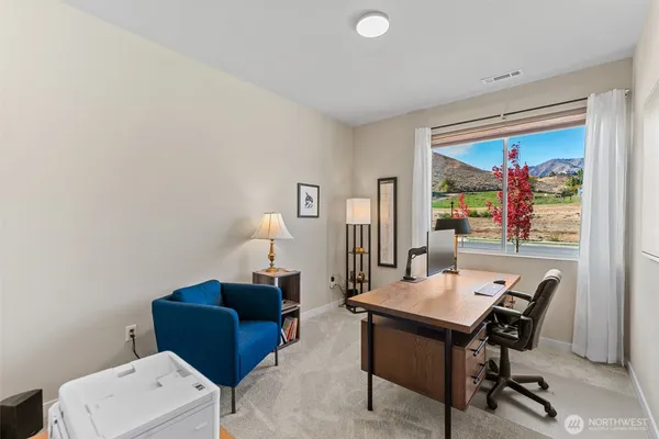 a view of a workspace with furniture