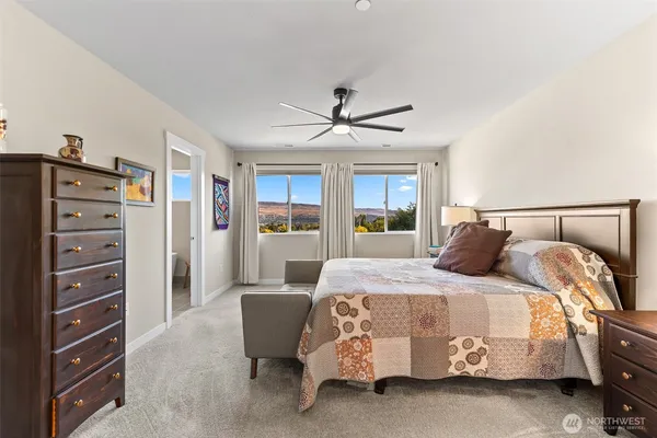 a bedroom with a bed and a dresser