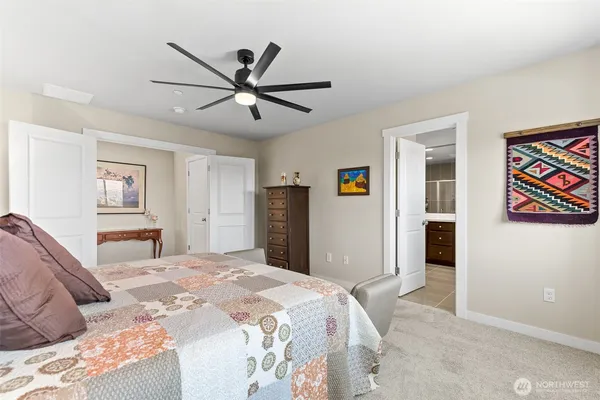 a bedroom with a large bed and a window