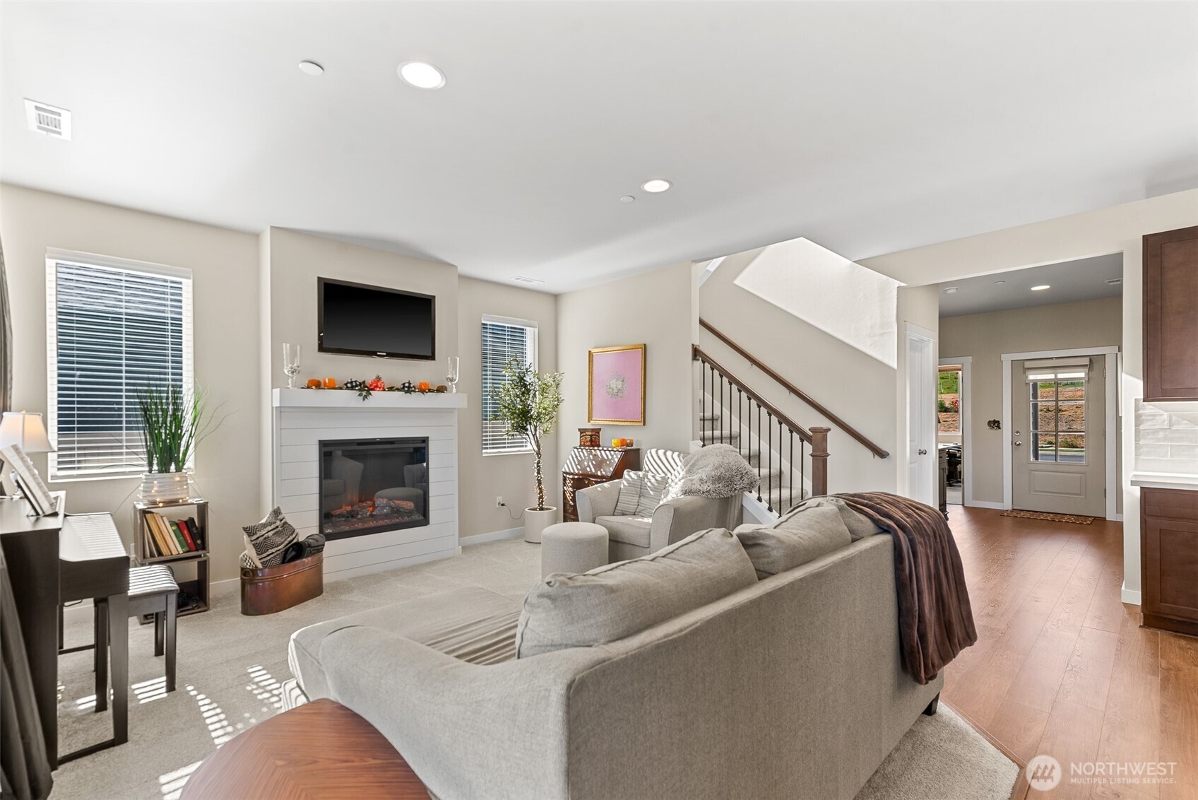 143 Sienna Road Wenatchee, WA 98801 - Photo 3 of 40 a living room with furniture a fireplace and a flat screen tv