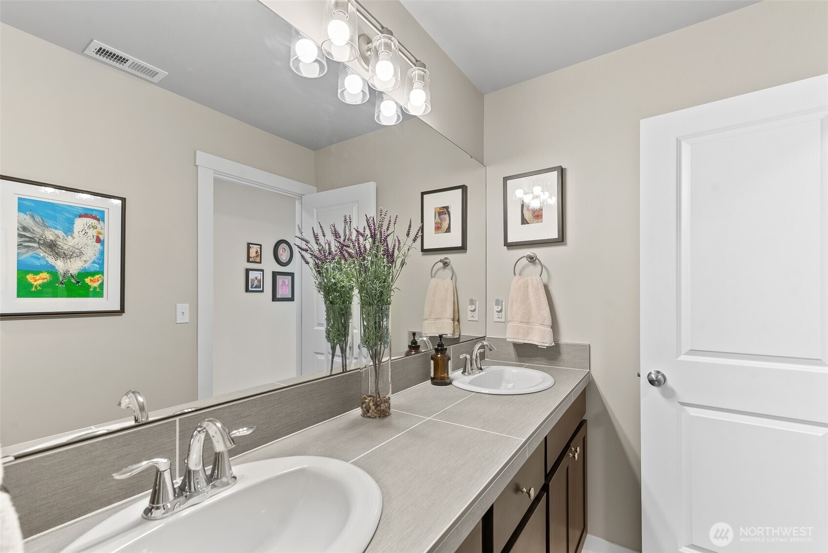 143 Sienna Road Wenatchee, WA 98801 - Photo 31 of 40 a bathroom with a sink double vanity and a mirror