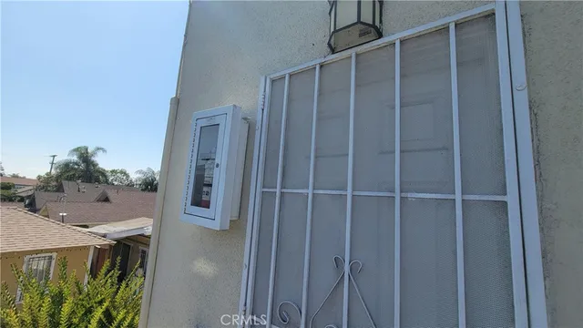 a view of staircase with railing and white walls