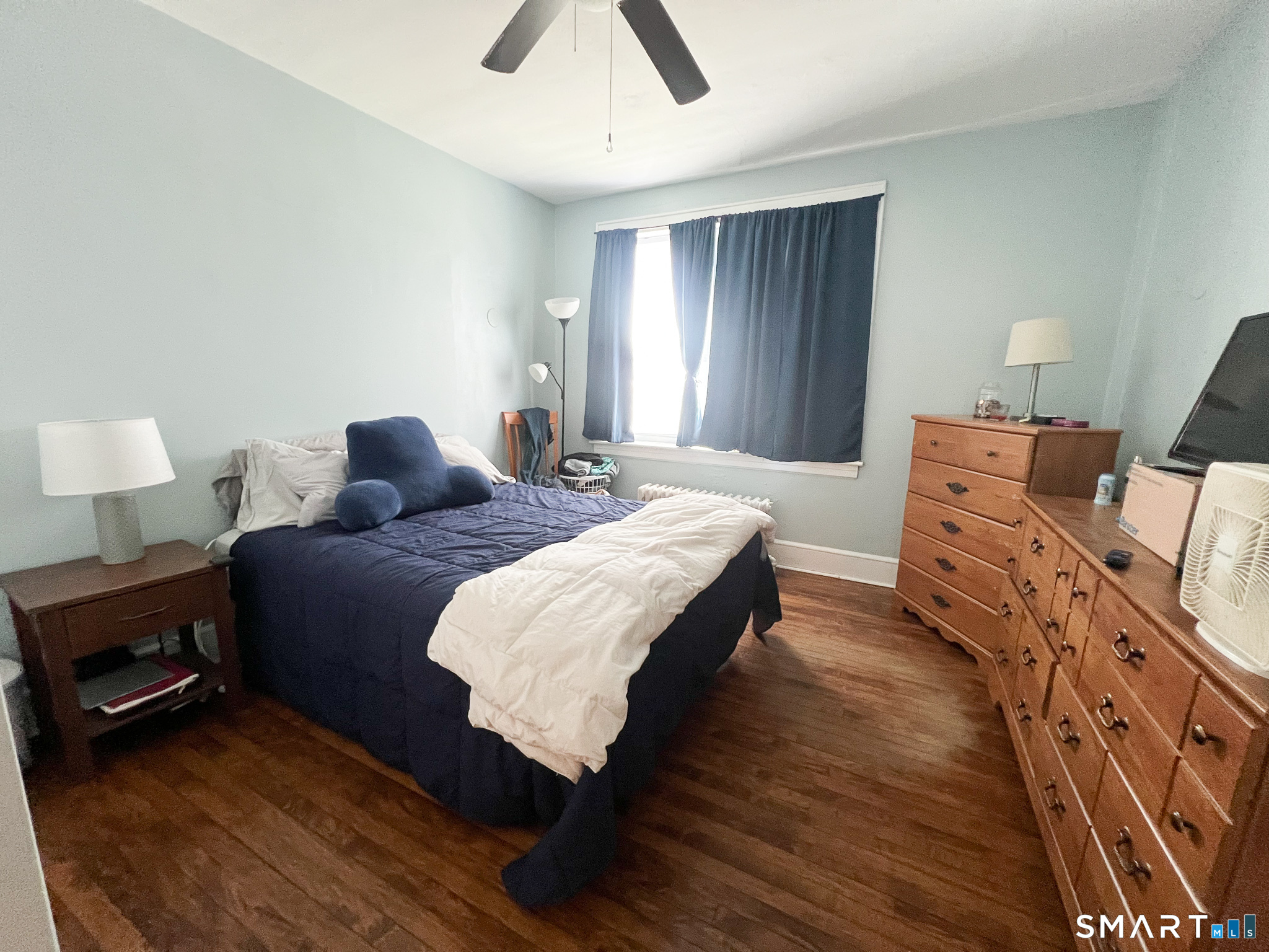 793 Milford Point Road, Unit 1 Milford, CT 06460 - Photo 7 of 8 a bedroom with bed and window