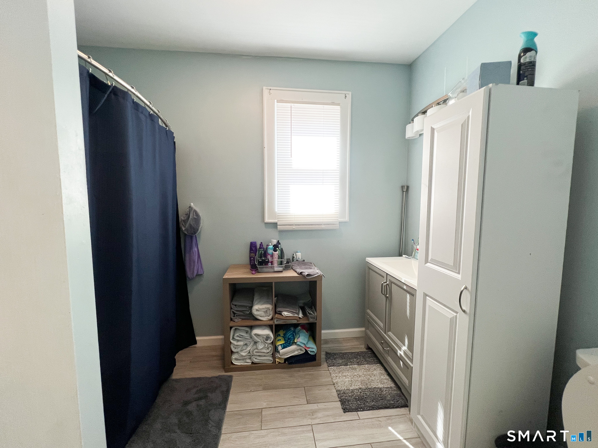 793 Milford Point Road, Unit 1 Milford, CT 06460 - Photo 8 of 8 a room with furniture and a window
