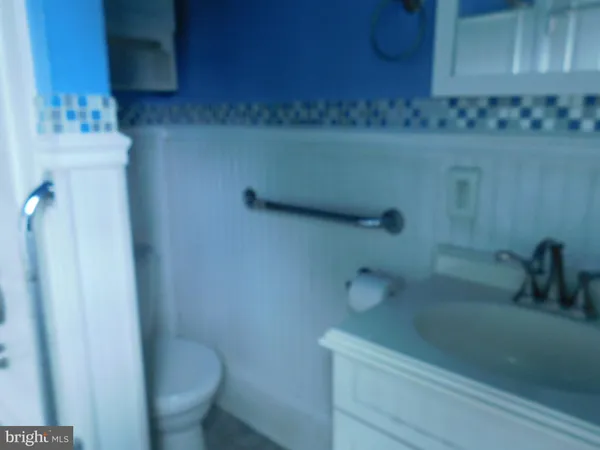 a view of a room with wooden floor and cabinet