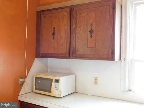 a kitchen with stainless steel appliances granite countertop a refrigerator a stove and a cabinets