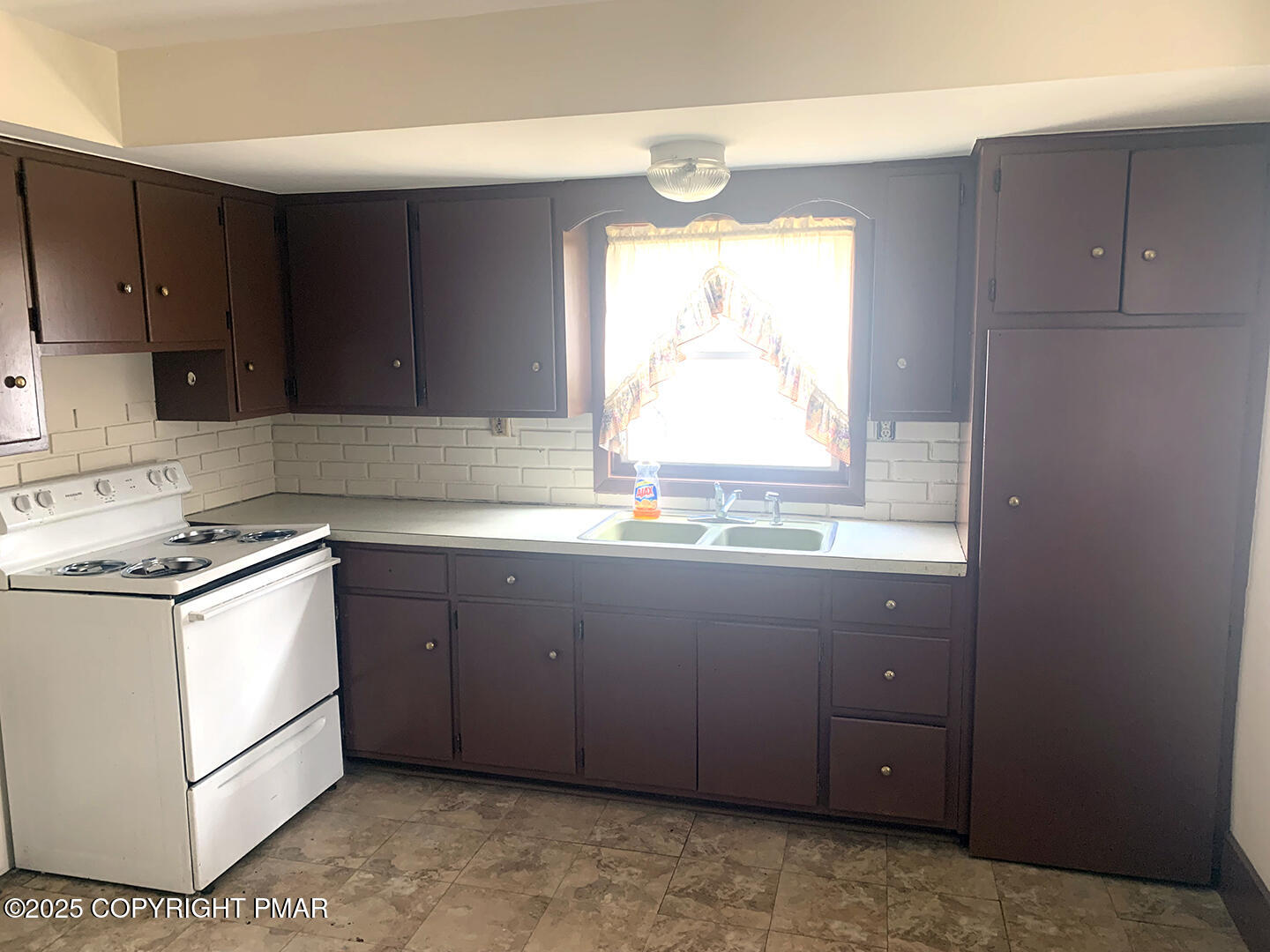 729 Ann Street Stroudsburg, PA 18360 - Photo 14 of 21 a kitchen with granite countertop a sink and a stove