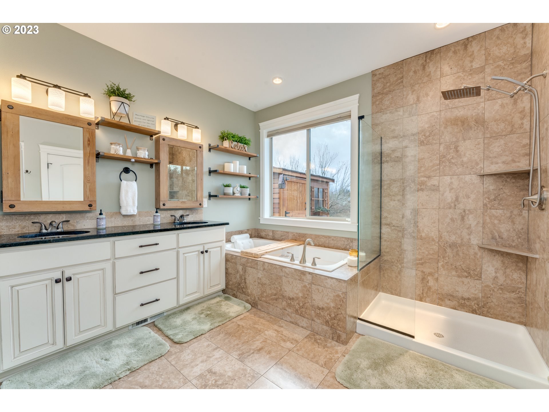 117 North 38th Place Ridgefield, WA 98642 - Photo 12 of 32 a spacious bathroom with a granite countertop tub sink a mirror a shower and vanity