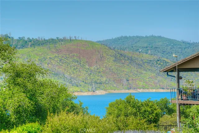 a view of an room with wooden floor and a ceiling fan