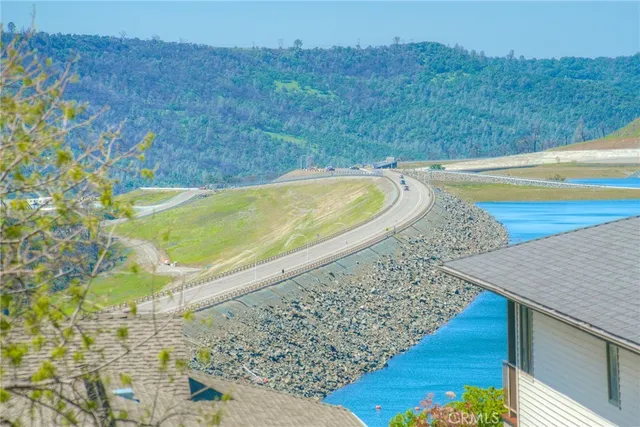 a bathroom with a granite countertop sink and a large mirror