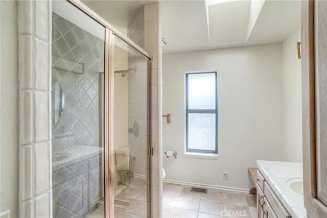 a view of a livingroom with wooden floor and stairs