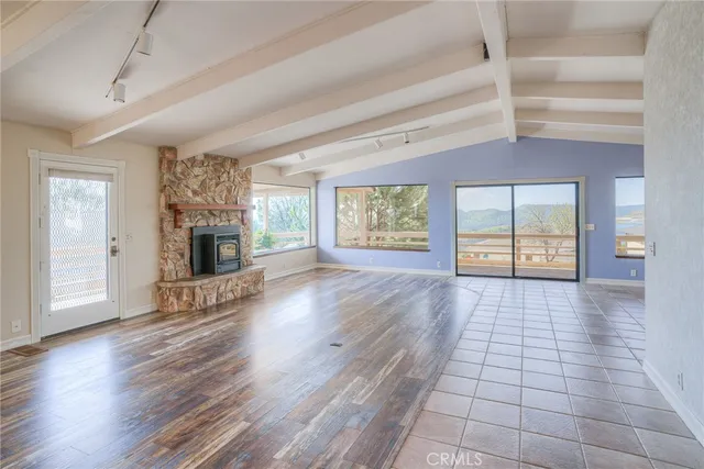a view of a room with wooden floor