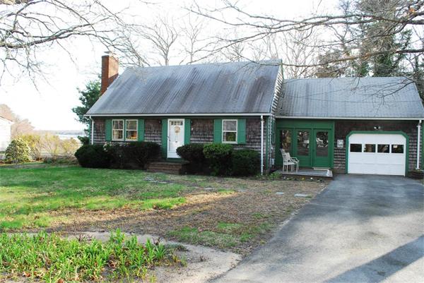 84 Converse Road Marion, MA 02738 - Photo 1 of 1 a view of a house with a garden
