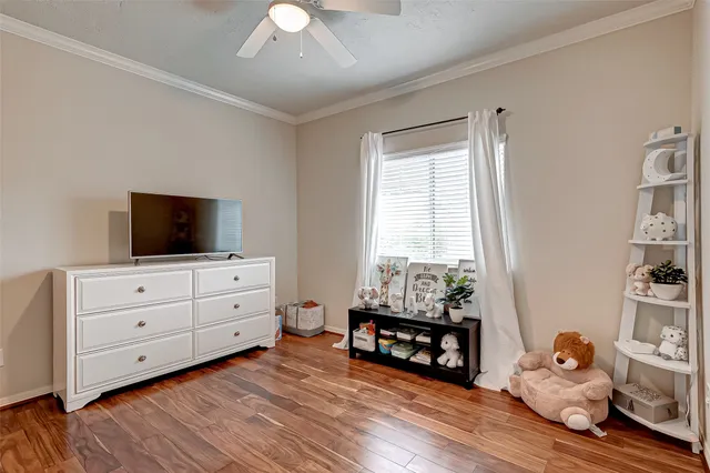 a room with wooden floor and furniture