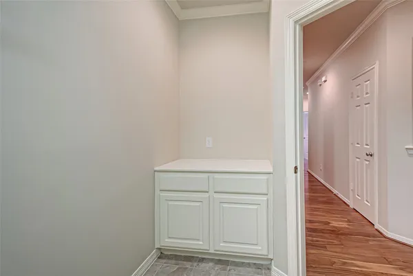 a view of front door with wooden floor