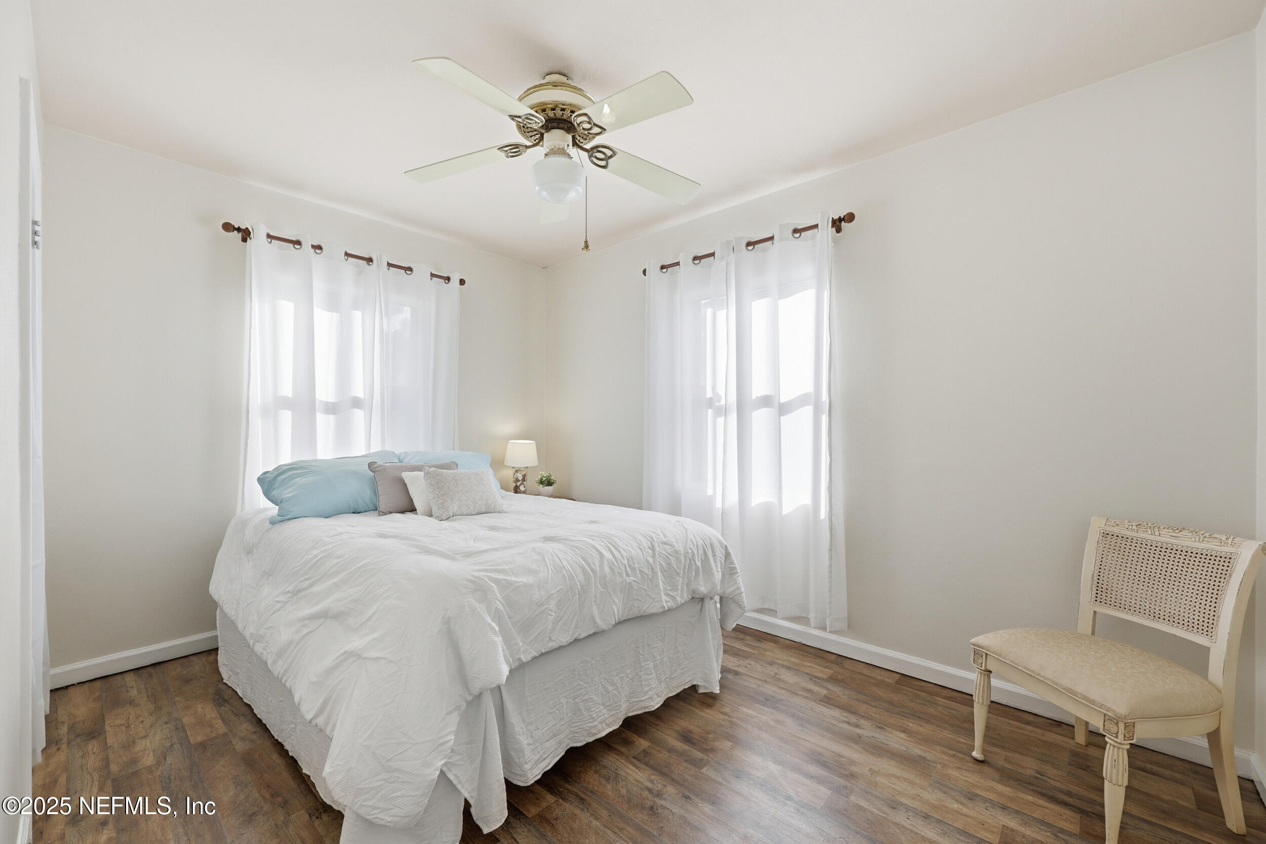 2947 Kline Road Jacksonville, FL 32246 - Photo 13 of 29 a bedroom with a bed and a chair