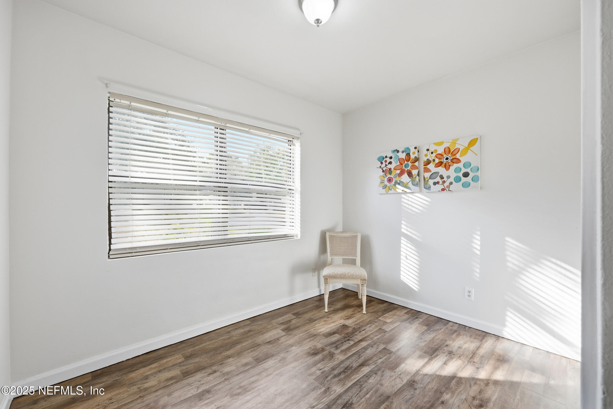 2947 Kline Road Jacksonville, FL 32246 - Photo 15 of 29 a view of room with window and wooden floor