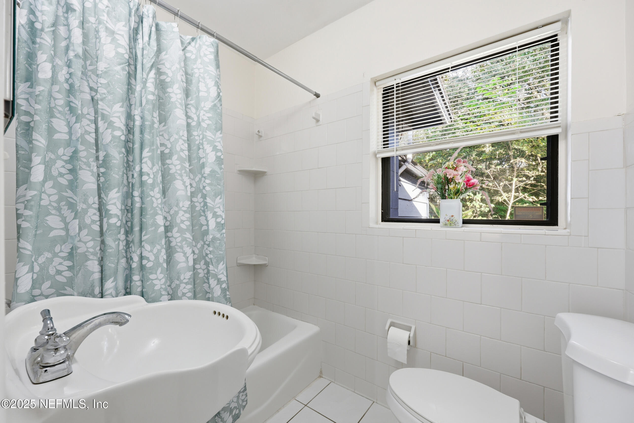 2947 Kline Road Jacksonville, FL 32246 - Photo 19 of 29 a bathroom with a sink and a mirror