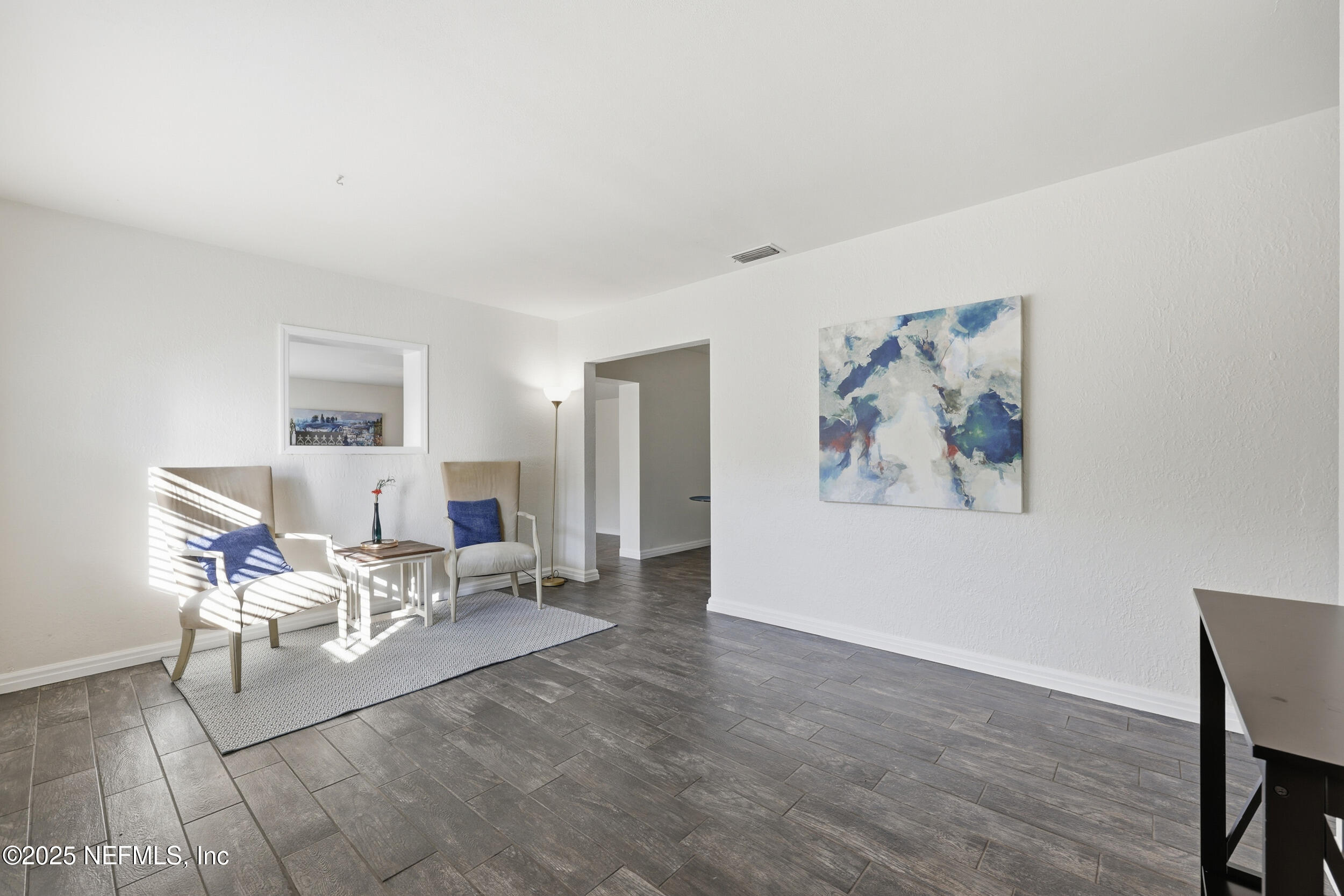 2947 Kline Road Jacksonville, FL 32246 - Photo 3 of 29 a living room with furniture and wooden floor