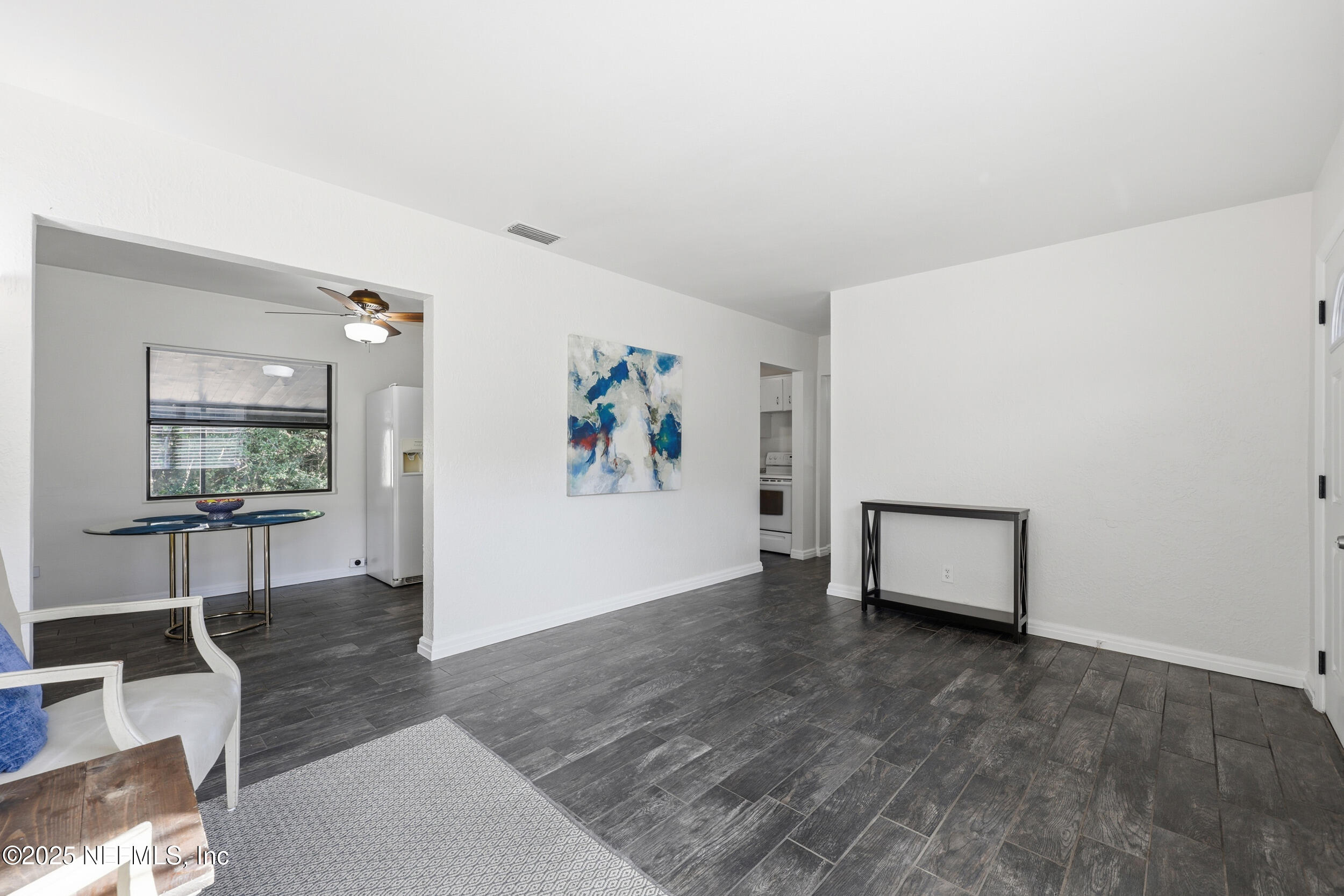 2947 Kline Road Jacksonville, FL 32246 - Photo 5 of 29 a view of a livingroom with wooden floor and a couch