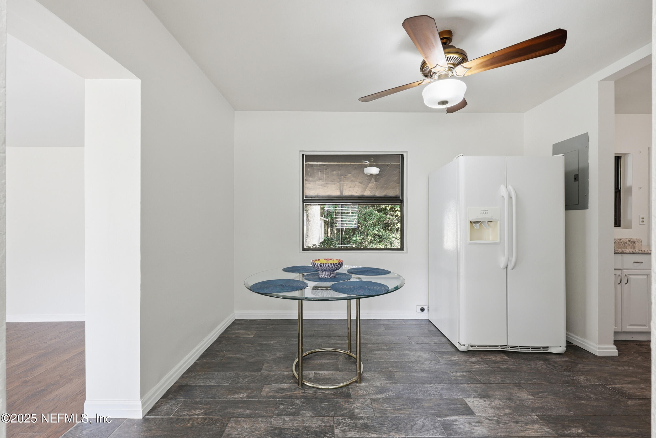 2947 Kline Road Jacksonville, FL 32246 - Photo 6 of 29 a view of a room with a chandelier fan and windows