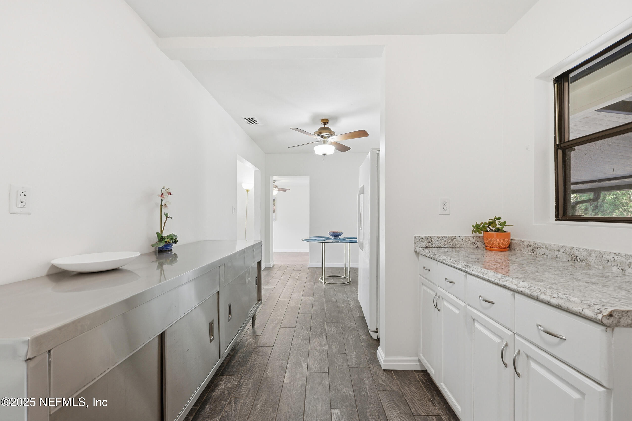 2947 Kline Road Jacksonville, FL 32246 - Photo 9 of 29 a hallway with sink and wooden floor