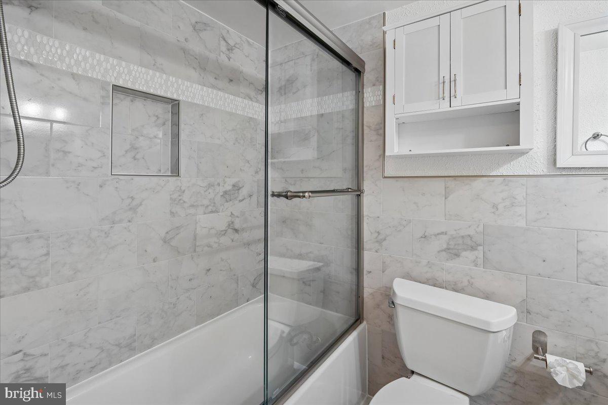 3940 Bel Pre Road, Unit 6 Silver Spring, MD 20906 - Photo 17 of 29 Elegant marble bathroom retreat.