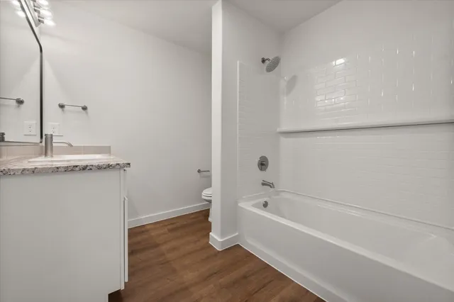 a bathroom with a bathtub and a sink