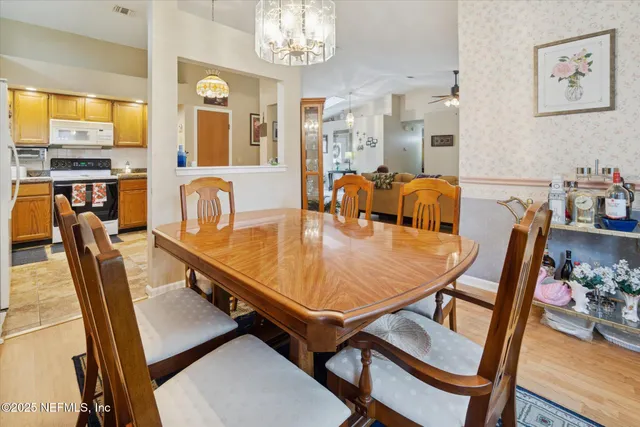 a dining room with furniture and window