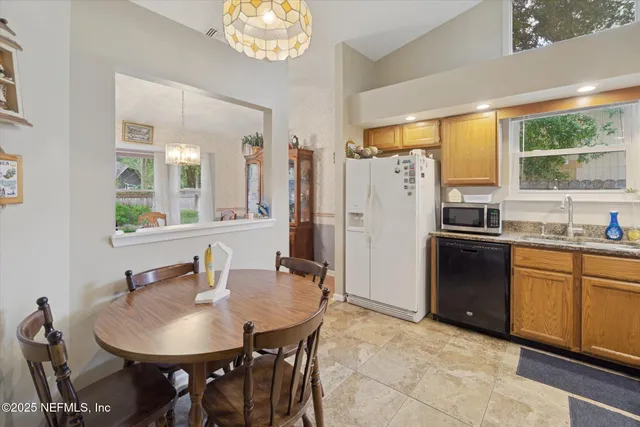 a kitchen with stainless steel appliances a sink stove and refrigerator