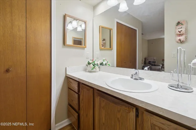 a bathroom with a sink and a mirror