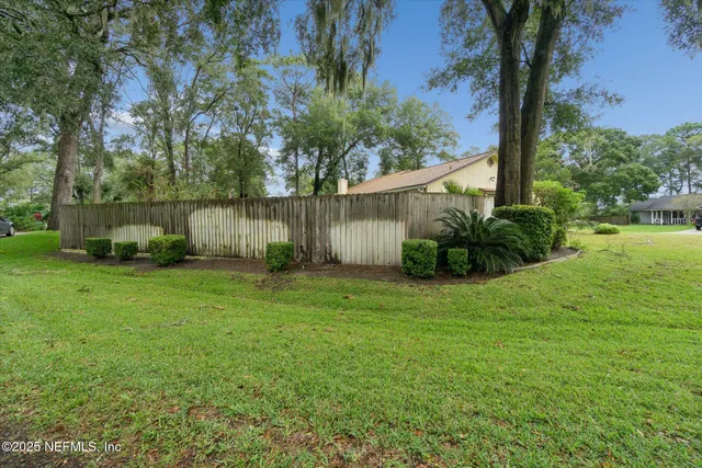 a backyard of a house with lots of green space