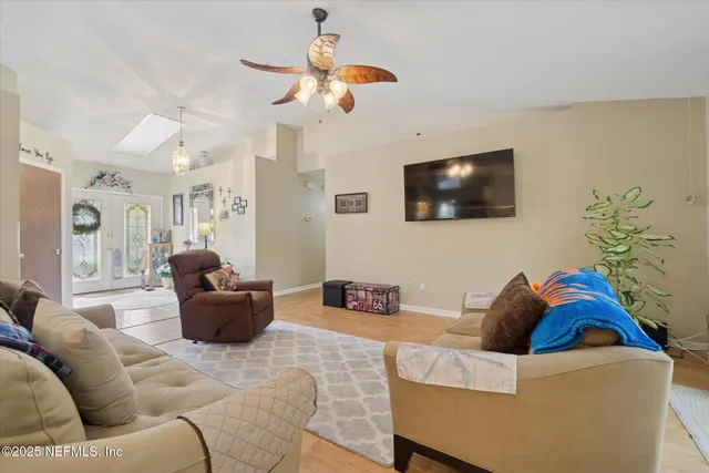 a living room with furniture and a flat screen tv
