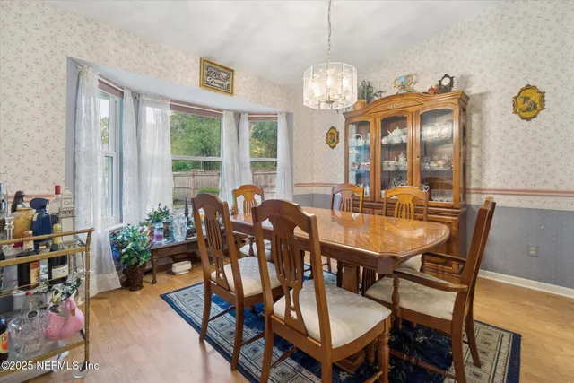 a view of a dining room with furniture window and outside view