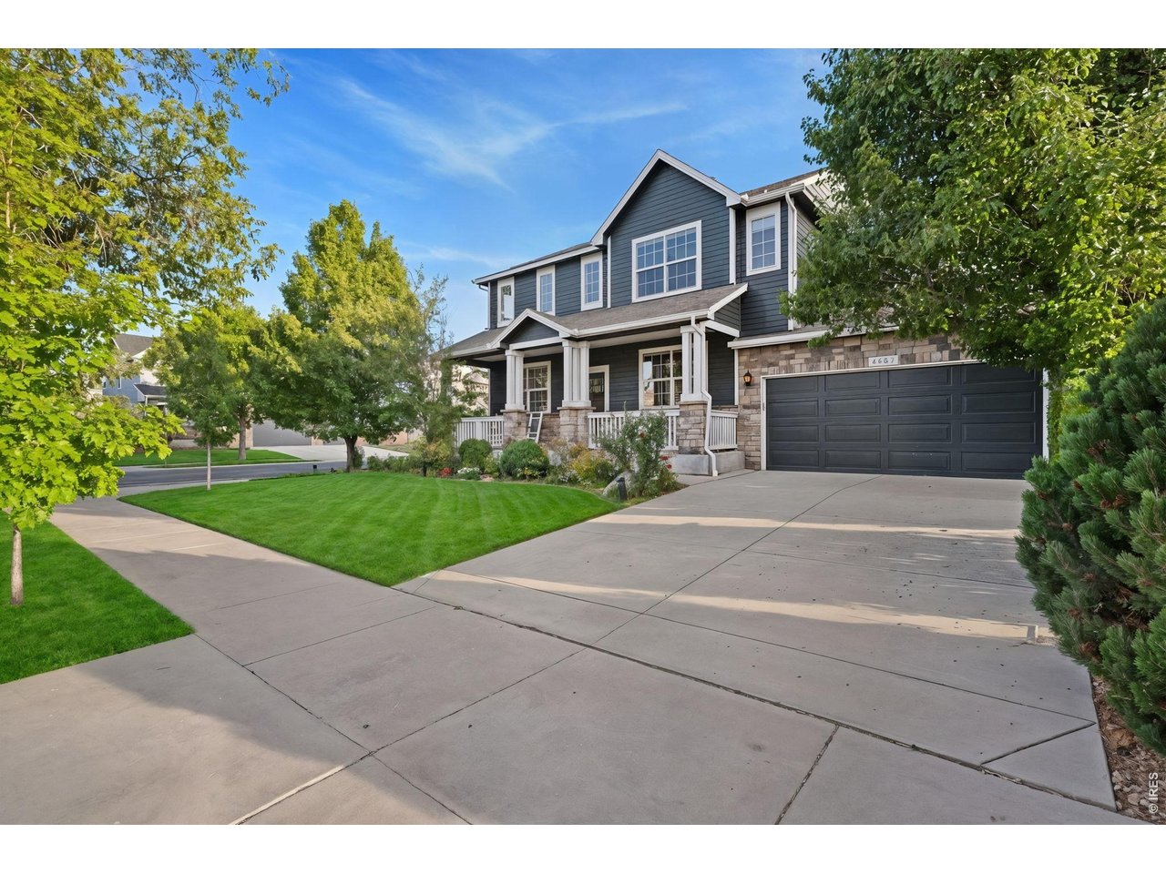 6363 Spring Valley Road Timnath, CO 80547 - Photo 3 of 43 Mature trees, custom stone work, and a corner lot make this home stand out!