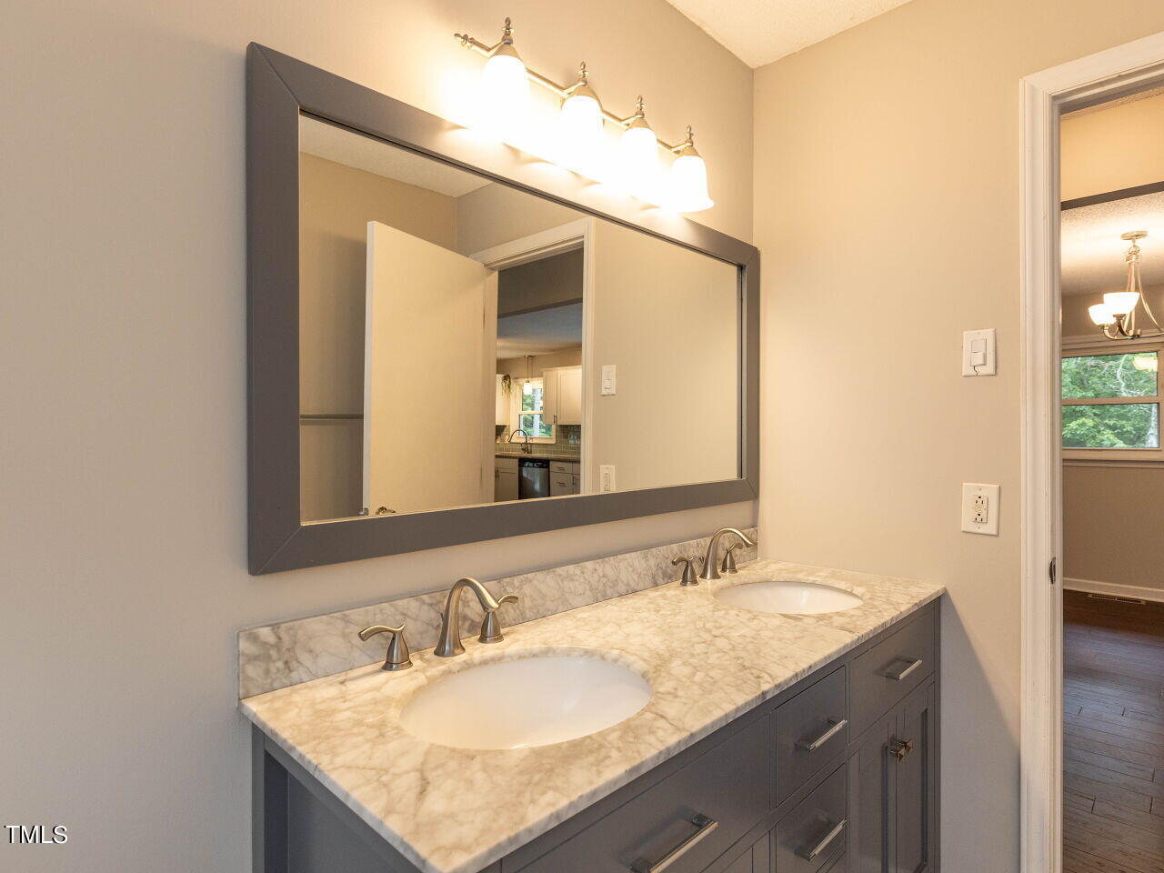 809 Lakeview Road Durham, NC 27712 - Photo 16 of 49 a bathroom with a granite countertop sink and a mirror
