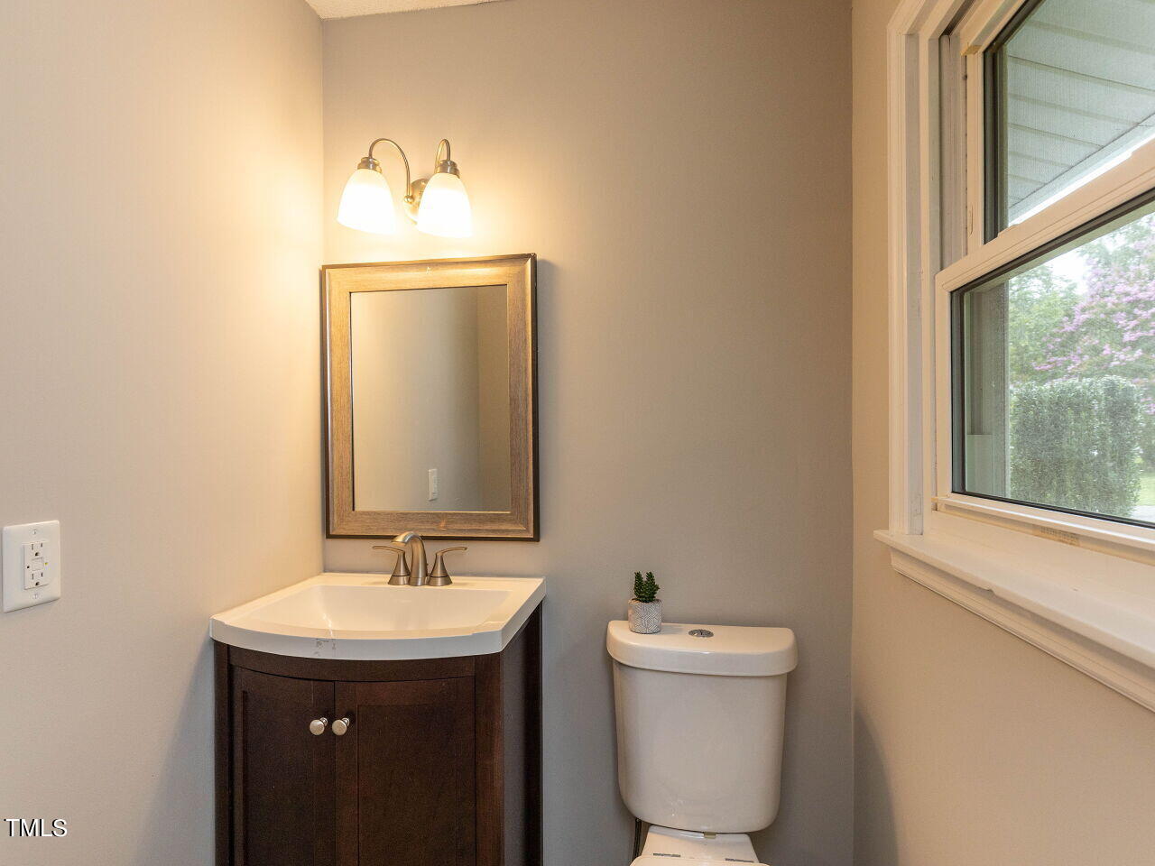 809 Lakeview Road Durham, NC 27712 - Photo 21 of 49 a bathroom with a toilet sink and mirror