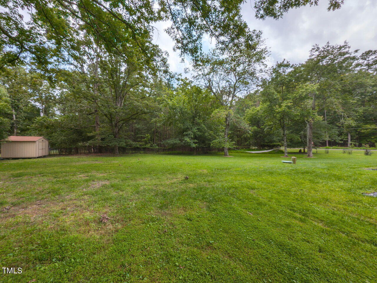 809 Lakeview Road Durham, NC 27712 - Photo 29 of 49 a view of a field of grass and trees