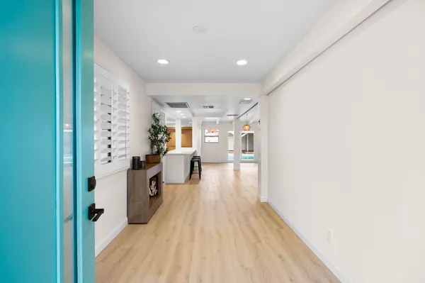 a view of an entryway with wooden floor