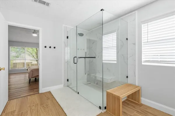 a bathroom with a bathtub and a shower