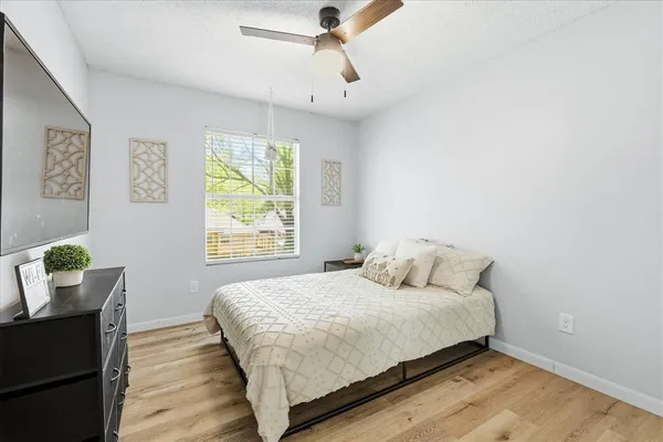 a bedroom with a bed and window