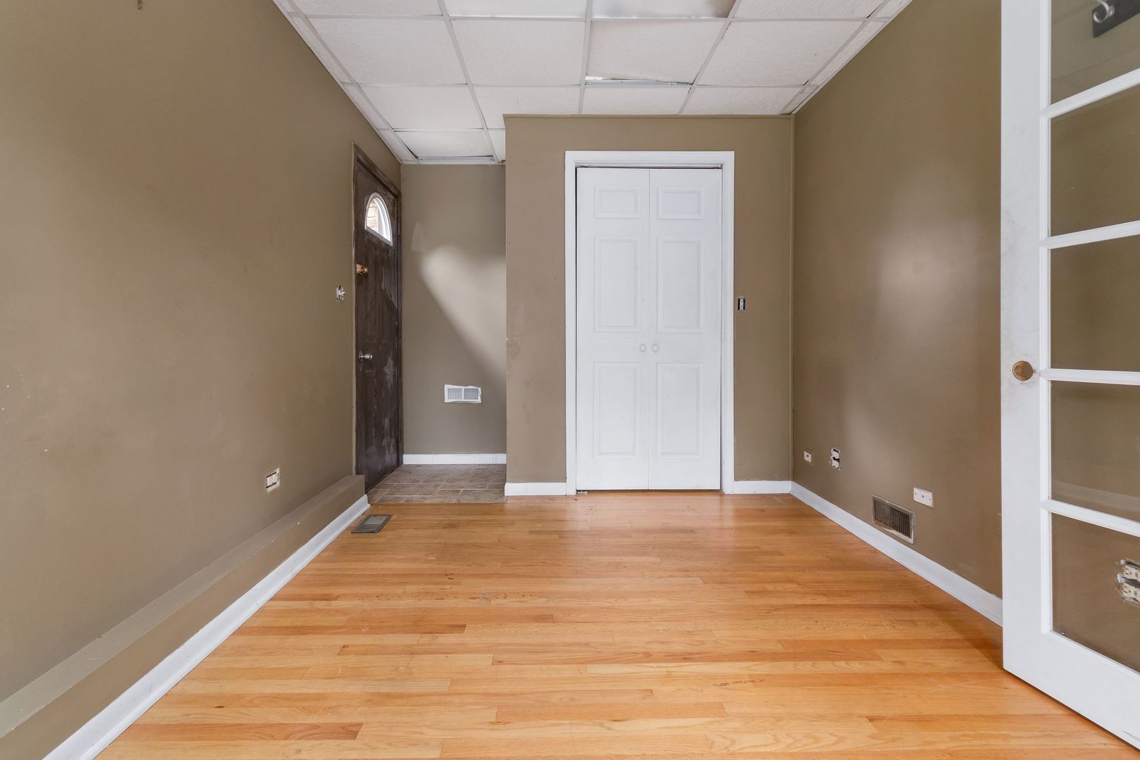 N659 Old Kirk Road West Chicago, IL 60185 - Photo 12 of 24 a view of an empty room with wooden floor and a bathroom