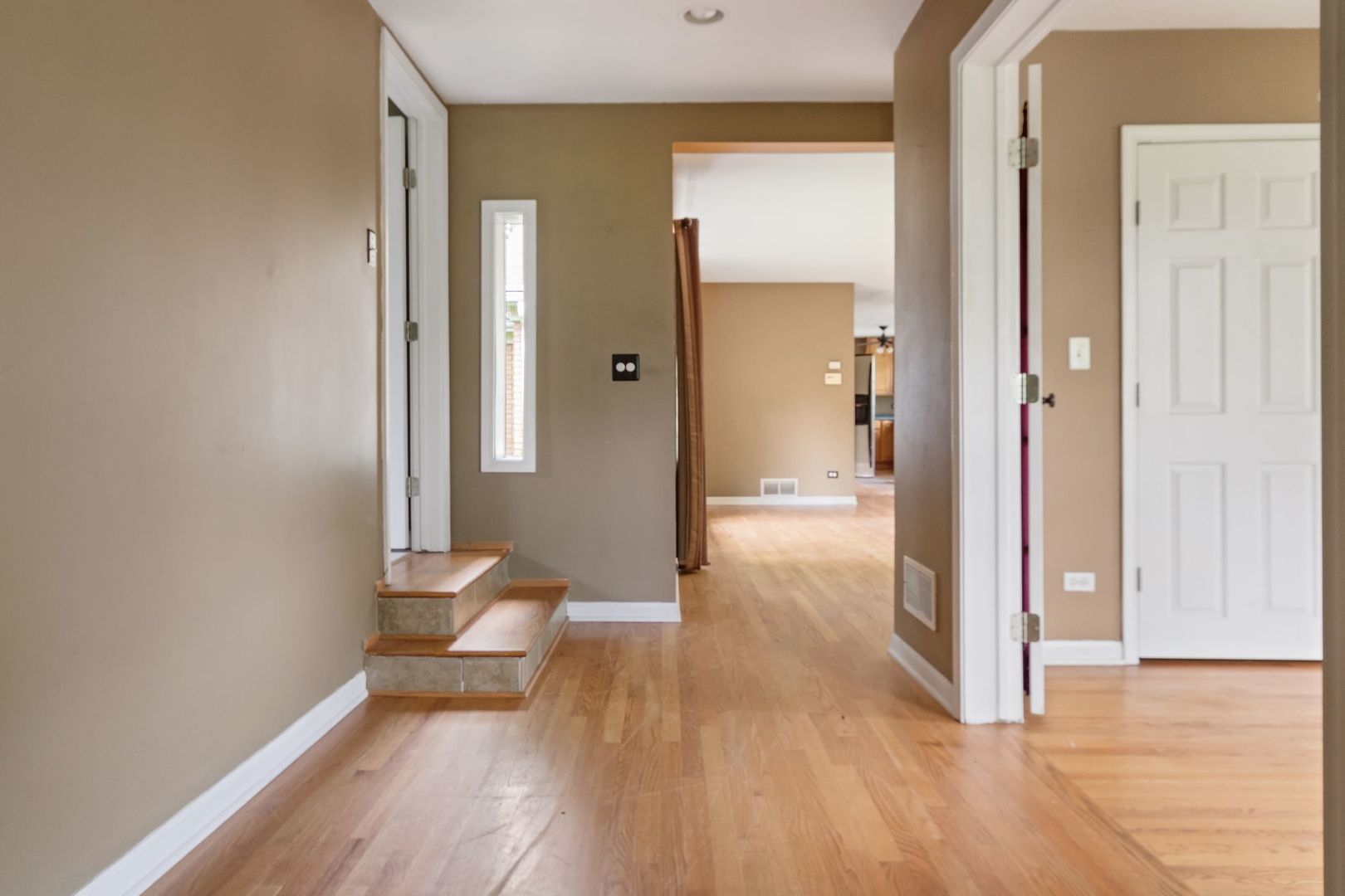 N659 Old Kirk Road West Chicago, IL 60185 - Photo 14 of 24 a view of a hallway with wooden floor and a bathroom