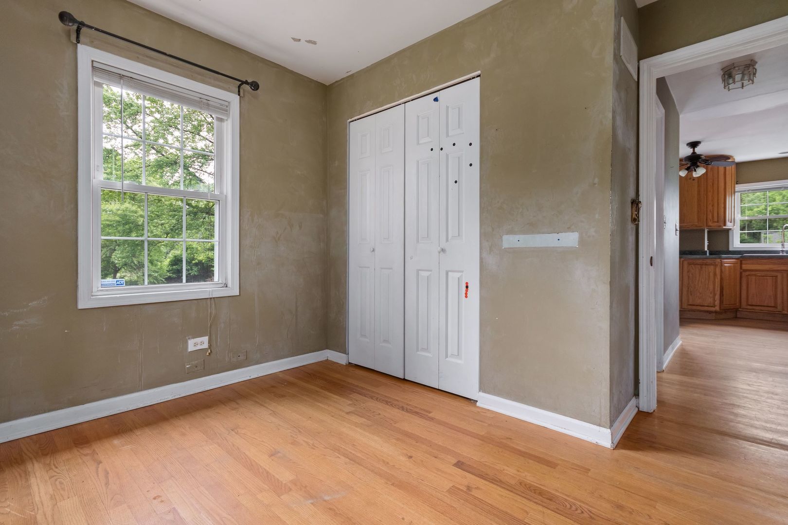 N659 Old Kirk Road West Chicago, IL 60185 - Photo 16 of 24 a view of empty room with wooden floor and fan