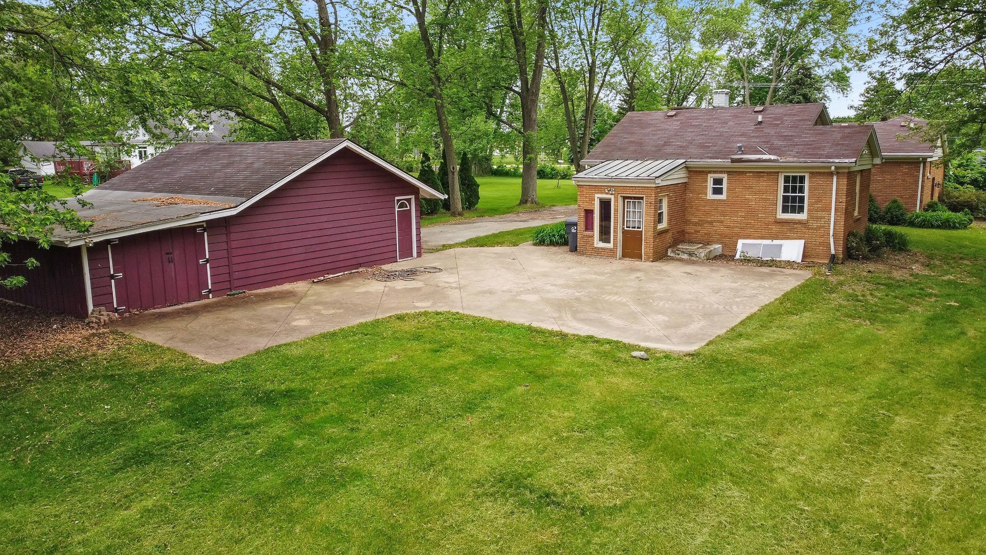 N659 Old Kirk Road West Chicago, IL 60185 - Photo 20 of 24 a front view of a house with a garden and yard