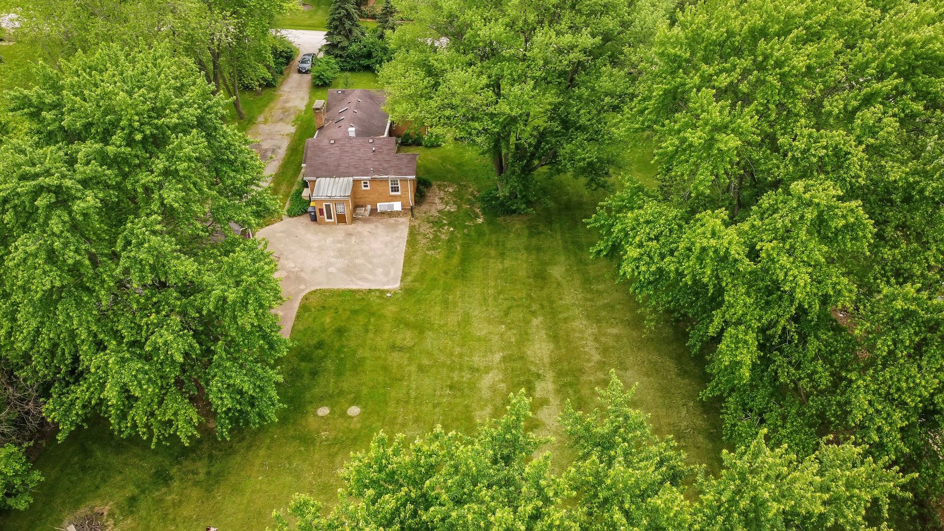 N659 Old Kirk Road West Chicago, IL 60185 - Photo 21 of 24 an aerial view of a house with a yard swimming pool and outdoor seating