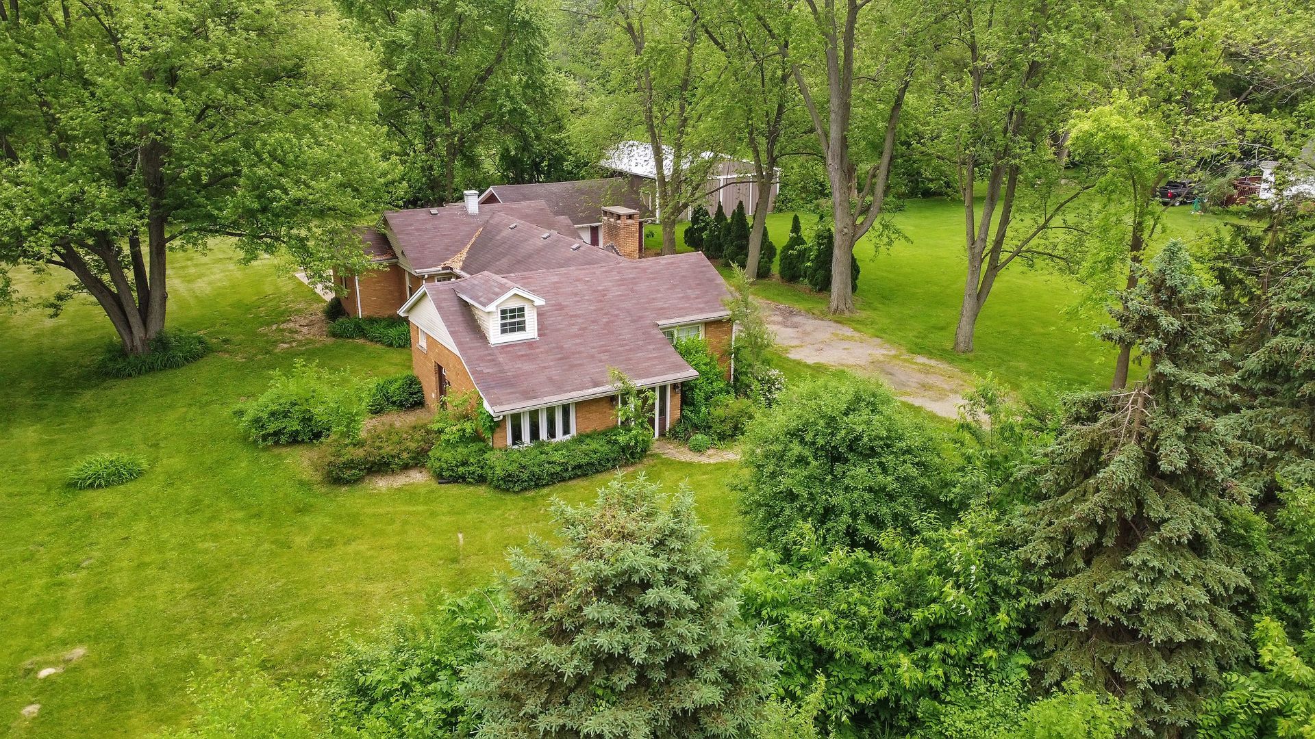 N659 Old Kirk Road West Chicago, IL 60185 - Photo 22 of 24 an aerial view of a house with big yard and large trees