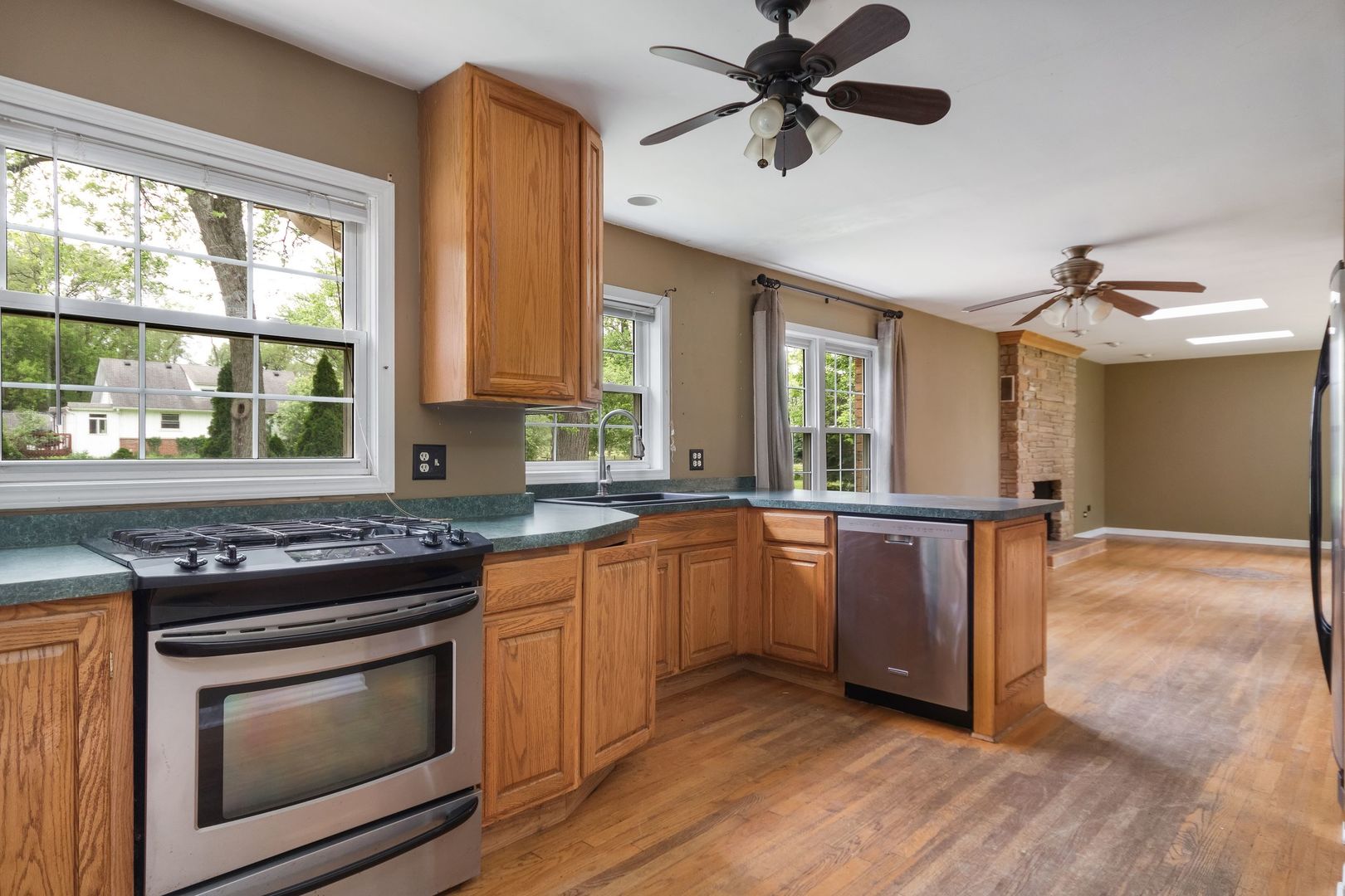 N659 Old Kirk Road West Chicago, IL 60185 - Photo 3 of 24 a kitchen with stainless steel appliances granite countertop a stove and a sink