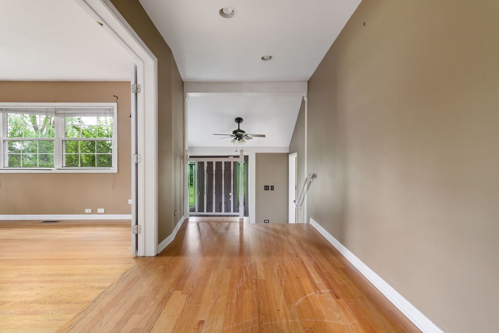 N659 Old Kirk Road West Chicago, IL 60185 - Photo 8 of 24 a view of a room with wooden floor fireplace and windows